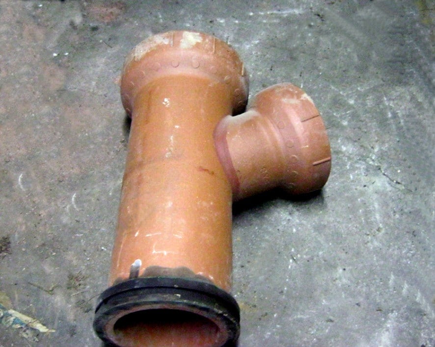 Clay sewer pipe fitting.