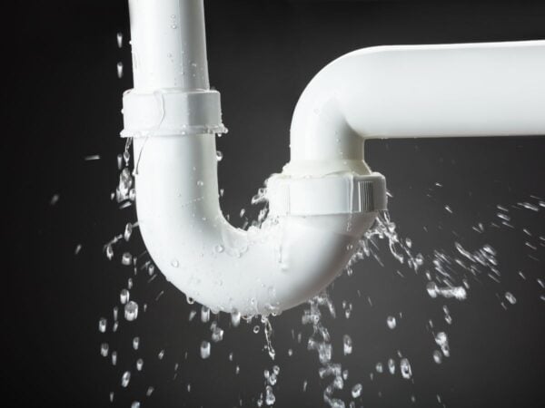 Why is My Shower Backing Up? 3 water dripping water on a white pipe