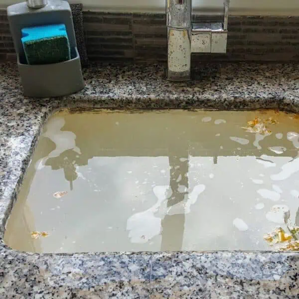 Most Common Causes of Sewer Backup Are For These Reasons 2 a sink with dirty water