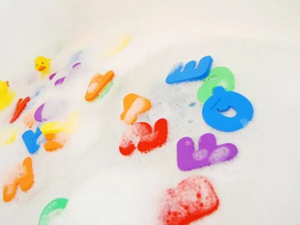 Why is My Shower Backing Up? 1 colorful letters in a bathtub