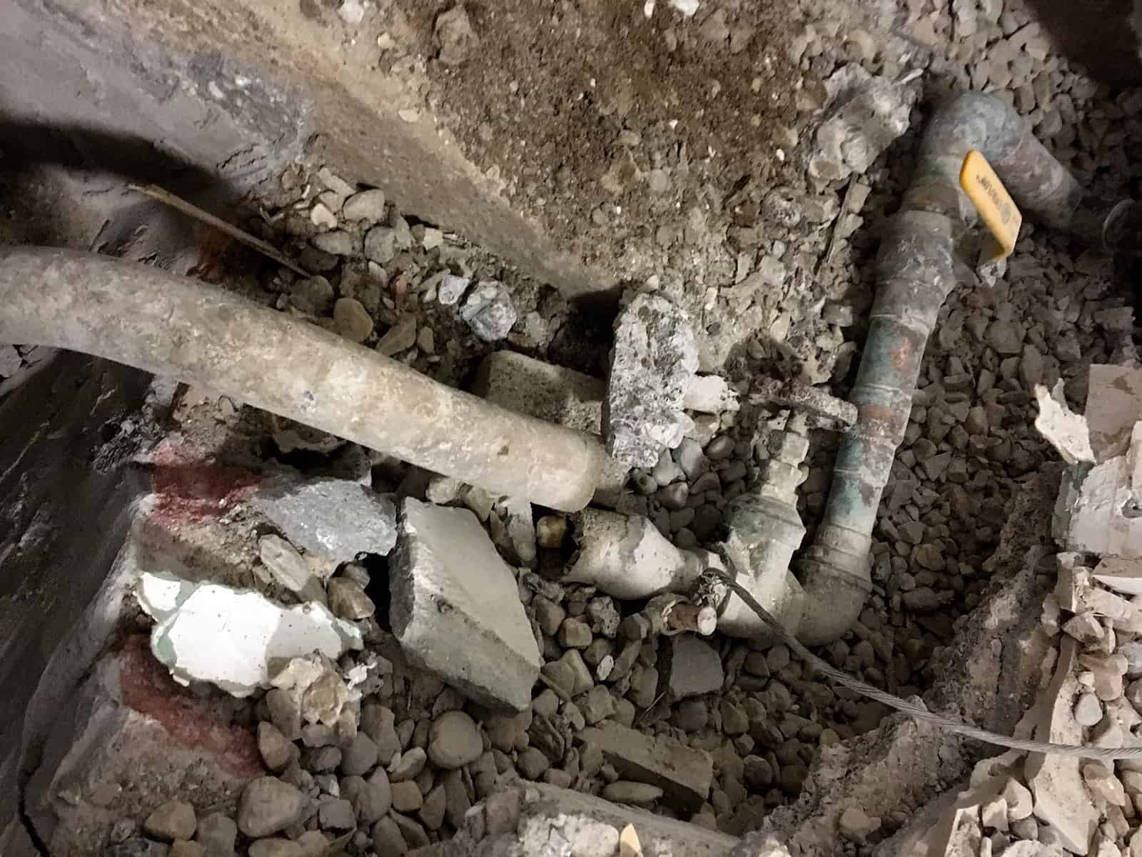 Broken lead water line within an excavation