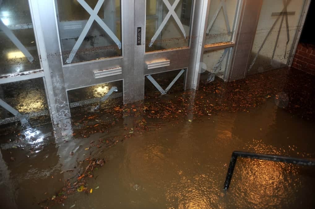 A building being flooded due to heavy and extreme rainfall.