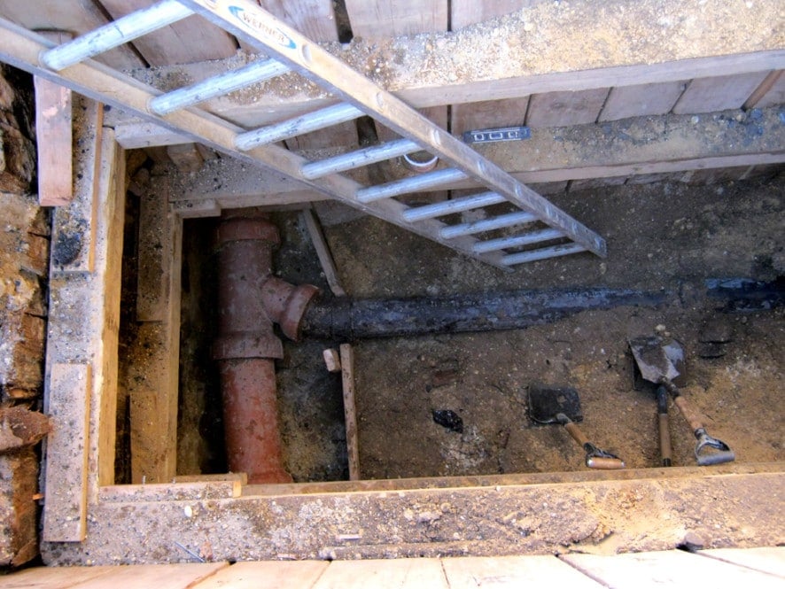 House sewer connection folded into a city sewer.