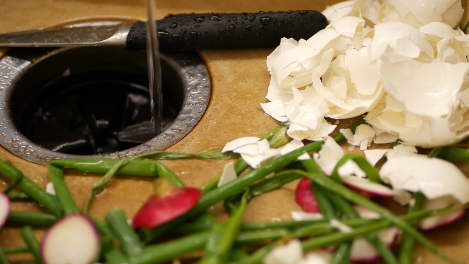 Picture of a sink grinder that got smelly due to an accumulation of food particles  