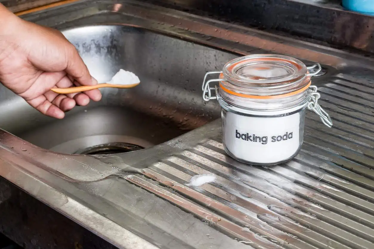 Baking soda being used to try to clean a drain line.